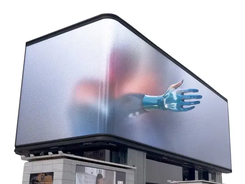 Pantalla LED 3D en la esquina de un edificio, con una mano que parece salir de la pantalla